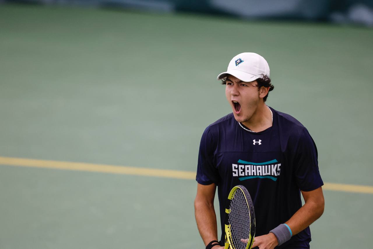 Bekhzod Rasamatov playing tennis