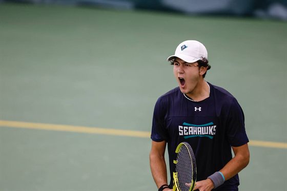 Bekhzod Rasamatov playing tennis